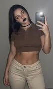Put her in a plain cute brown polo crop top and beige jeans, natural dslr photo, cocky head tilt, cu