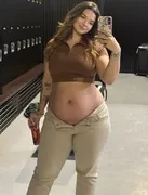 Put her in a plain cute brown polo crop top and beige jeans, natural dslr photo, cocky head tilt, cu